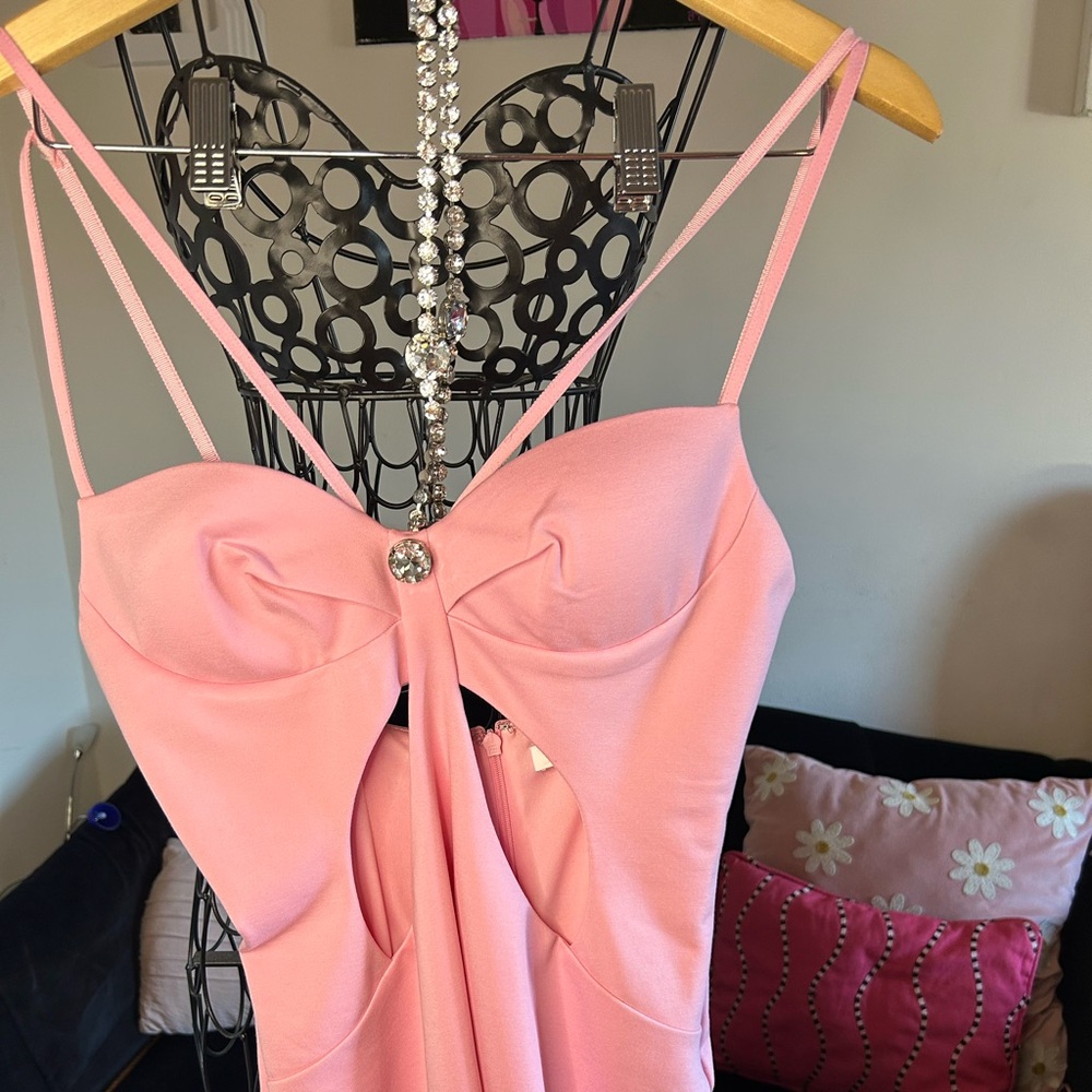Area designer mini dress with butterfly cutouts and silver hardware. Size medium